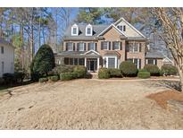 Charming brick two-story home with a manicured front yard and inviting curb appeal at 3604 Heritage Creek Dr, Apex, NC 27539