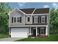 Charming two-story home with gray siding, a two-car garage, and a covered front porch at 53 Mildred Pl, Broadway, NC 27505