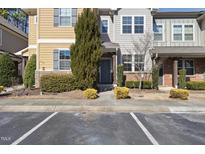 Charming townhome with manicured landscaping and a welcoming entrance at 684 Wickham Ridge Rd, Apex, NC 27539