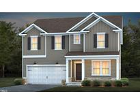 Charming two-story home featuring a two-car garage, neutral siding, and a welcoming front porch at 724 Denburn Pl, Raleigh, NC 27603