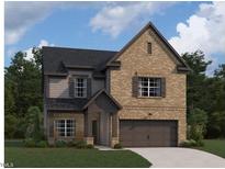 Charming two-story home featuring a brick facade, inviting entrance, and attached two-car garage at 1400 Malcus Ct # 57, Fuquay Varina, NC 27526