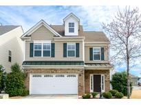 A two-story home with a well-manicured front yard at 309 Mainline Sta, Morrisville, NC 27560