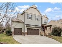 Charming two-story home with attached three-car garage and a spacious driveway at 1720 Waddell Ct, Durham, NC 27703