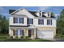 Two story new build home featuring white siding, black shutters, brick facade, and attached two car garage at 186 Ethel Ln, Angier, NC 27501