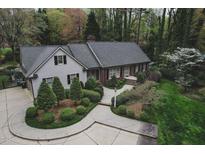Lovely single story home featuring a winding walkway and a beautiful, professionally landscaped front yard at 515 S Woodland Rd, Henderson, NC 27536