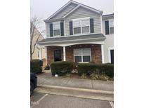 Charming two-story townhome with a stone-accented porch and well-maintained landscaping at 1304 Cozart St # 414, Durham, NC 27704