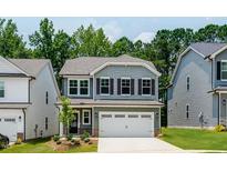 Charming two-story home with a two-car garage and inviting front yard in a desirable neighborhood at 136 Blue Butterfly Dr, Angier, NC 27501