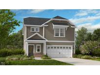 Charming two-story home with a gray color scheme, dormer windows, and a two-car garage at 174 Blue Butterfly Dr, Angier, NC 27501