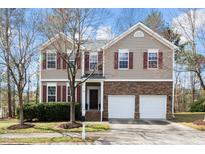 Charming two-story home with red shutters, stone accents, and a well-manicured lawn at 206 Whitney Ln, Durham, NC 27713