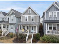 Charming two-story home with a welcoming porch and a well-maintained front yard at 656 Groveview Wynd, Wendell, NC 27591