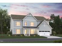 Charming two-story home with covered porch, stylish trim, and a two-car garage at 1124 Opal Ln # 88, Durham, NC 27705
