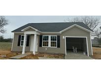 Charming single-story home features vinyl siding, black shutters, and an attached one-car garage at 114 Johnson Ridge Way, Four Oaks, NC 27524