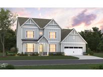 Charming two-story home with attached two-car garage, manicured lawn, and craftsman style columns at 1204 Opal Ln # 93, Durham, NC 27705