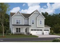 Charming two-story home with light-green siding, a three-car garage, and a welcoming front porch at 2016 Skipping Stone Dr # 162, Durham, NC 27705