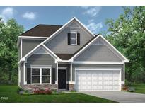 Two-story home with gray siding, stone accents, and a two-car garage at 147 Vega Loop, Sanford, NC 27330