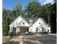 Charming new construction home featuring board and batten siding and a classic front porch at 60 Valebrook Ct, Youngsville, NC 27596