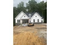 Charming new construction home with white siding and stone accents on a spacious lot at 60 Valebrook Ct, Youngsville, NC 27596