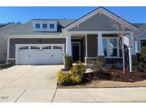 Charming home with a two-car garage, well-maintained lawn, and neutral-colored exterior at 1216 Blue Mist Ct, Apex, NC 27502