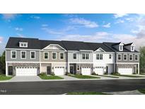Charming townhome exteriors feature stone accents, neutral siding, and attached garages for a modern look at 270 Sweetbay Tree Dr, Wendell, NC 27591