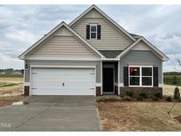 Charming single-Gathering home featuring a two-car garage and craftsman-style architectural details at 72 E Victory View Ter, Smithfield, NC 27577