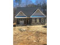 Charming single-Gathering home featuring stone accents, a covered porch, and a classic design at 80 Valebrook Ct, Youngsville, NC 27596