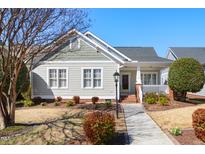 Charming home featuring meticulous landscaping, a walkway, and a covered front porch at 10617 Catara Dr, Raleigh, NC 27614