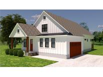 New construction shows a charming two-story home with a landscaped yard and attached garage at 2966 Forest Creek Ln, Mebane, NC 27302
