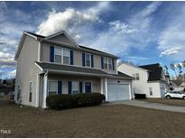 Charming two-story home featuring a two-car garage and manicured landscaping at 271 Mayors Lane Ln, Wendell, NC 27591