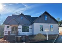 An attractive new build with a stylish design, complemented by a well-manicured lawn and neighborhood at 55 Cherry Bark Dr, Youngsville, NC 27596