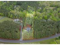 Scenic aerial view of property showcasing the surrounding lush greenery and approximate property lines at 749 Bowden Rd, Chapel Hill, NC 27516