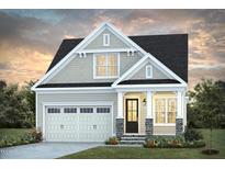 Charming two-story home featuring a black roof, stone accents, manicured lawn, and an attached garage at 101 Big Bradley Dr, Wendell, NC 27591