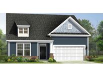 Charming exterior view of a two-story home with a dark roof, blue siding, and a two-car garage at 121 Willow Cameron Way, Angier, NC 27501