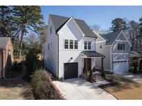 Beautiful two story home with black trimmed windows, neutral color scheme, and a two car garage at 304 Shepherd St, Raleigh, NC 27607