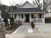 Charming single-story home with a welcoming front porch and meticulously landscaped yard at 312 East End Ave, Durham, NC 27703