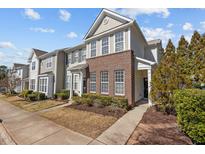 Charming townhouse with brick facade, well-maintained landscaping, and inviting curb appeal at 7850 Silverthread Ln, Raleigh, NC 27617