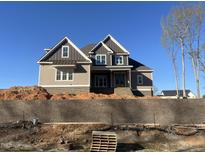 New construction home featuring craftsman-style details and a combination of siding and brick finishes at 165 Cotton Fields Ln # 25, Fuquay Varina, NC 27526