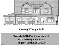 Exterior elevation of the home showcasing the architectural design and multiple car garage at 3817 Fairway View Dr # 10, Fuquay Varina, NC 27526