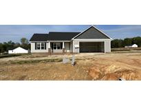 Charming single Gathering home with a two-car garage and covered entry in a new construction neighborhood at 39 N Movado Trl, Kenly, NC 27542