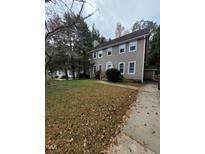 Charming two-story home with light siding, a well-kept lawn, and inviting front porch at 4204 Labrador Dr, Raleigh, NC 27616