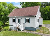 Charming home featuring a well-maintained yard, fresh paint, and a welcoming front porch at 524 N Occoneechee St, Hillsborough, NC 27278