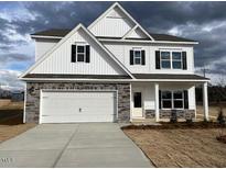 Charming two-story home with a two-car garage and neutral paint at 30 Olivia Crossing Ct, Smithfield, NC 27577