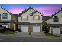 Charming townhome with brick accents, private garage, and welcoming curb appeal at 1306 Plexor Ln, Knightdale, NC 27545