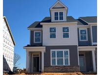 New construction home featuring gray and white siding and an inviting front porch at 1573 Wendell Valley Blvd, Wendell, NC 27591