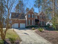 Elegant two-story brick home with a well-maintained lawn and two-car garage at 3510 Middlebrook Dr, Durham, NC 27705
