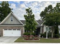 Charming single-story home with a two-car garage, landscaped front yard, and inviting curb appeal at 2851 Wilkes Lake Dr, Fuquay Varina, NC 27526