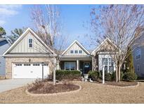 Charming single-Gathering home with brick accents, two car garage, and landscaped front yard at 2851 Wilkes Lake Dr, Fuquay Varina, NC 27526