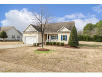 Charming single-Gathering home with a two-car garage and well-maintained landscaping at 55 Oak Leaf Dr, Lillington, NC 27546
