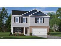 Charming two-story home with brick and gray siding, front lawn and attached two-car garage at 6028 Sodium St, Raleigh, NC 27610