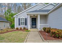 Charming home with a landscaped front yard and inviting entrance at 912 Homestead Park Dr, Apex, NC 27502