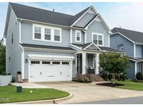 Charming two-story home with a two-car garage and inviting front porch at 286 Two Creeks Lp, Chapel Hill, NC 27517